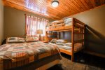 Lower Bedroom with queen bed and full-size bunks